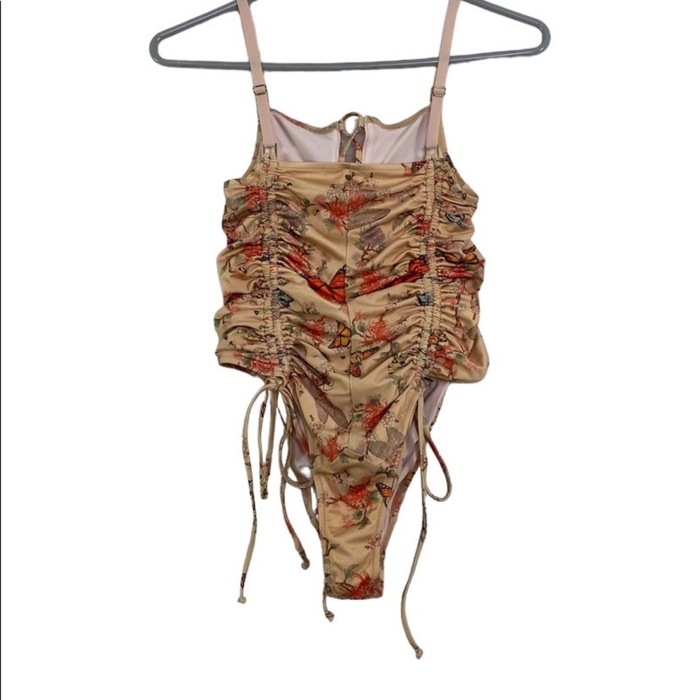 We are HAH Floral , Bee and butterfly One piece Size M